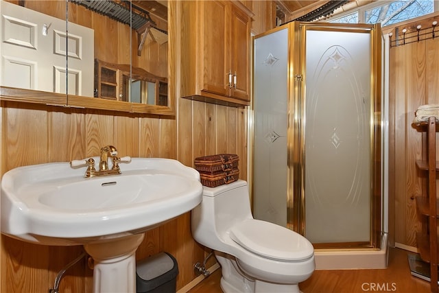 full bath featuring wooden walls, a stall shower, and toilet