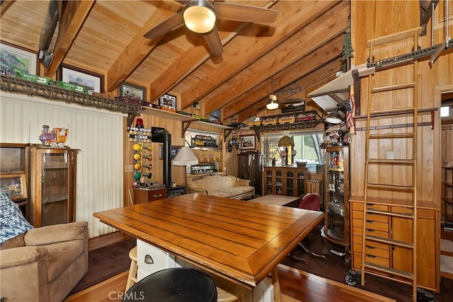 dining room featuring wood finished floors, wood ceiling, ceiling fan, and vaulted ceiling with beams