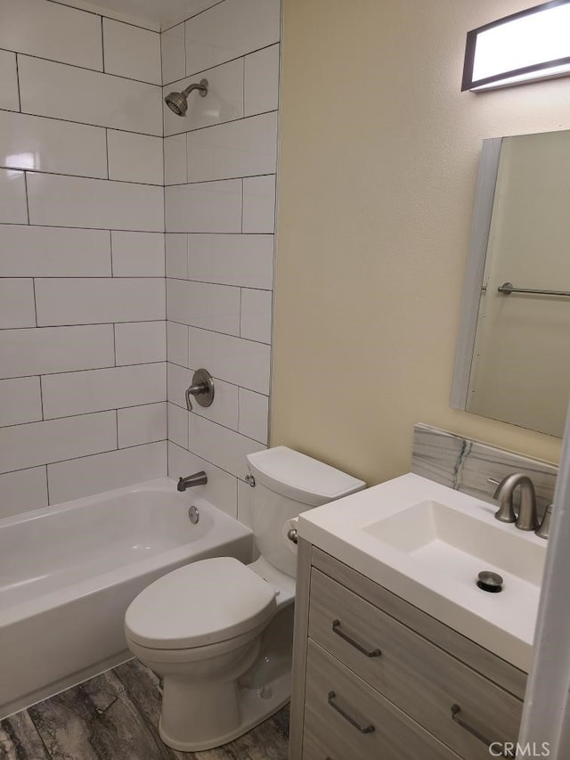 full bath with toilet, bathtub / shower combination, and vanity