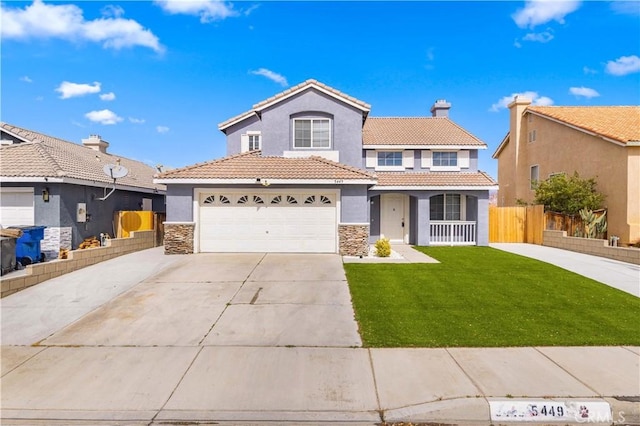 view of front of home with stucco siding, a tile roof, a front lawn, and fence