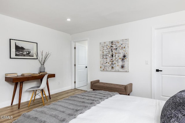 bedroom featuring recessed lighting, baseboards, and wood finished floors