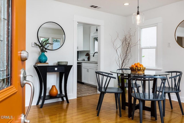 dining room with recessed lighting, visible vents, and light wood finished floors