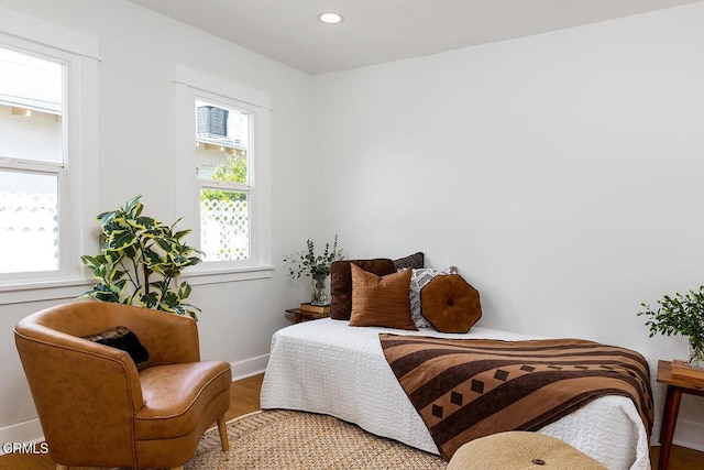 bedroom featuring recessed lighting, wood finished floors, and baseboards