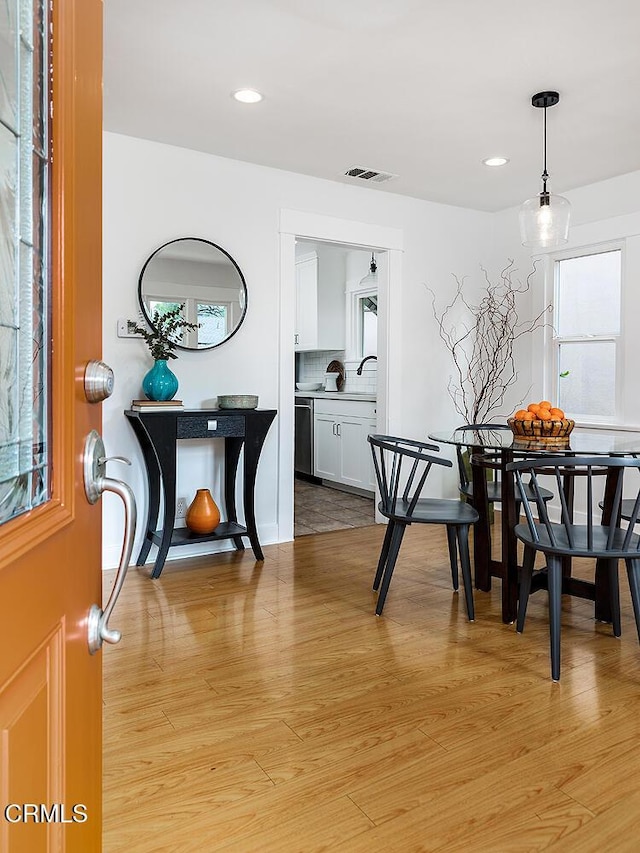 dining space with visible vents, recessed lighting, and light wood-style floors