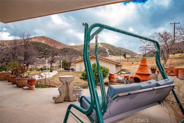 view of patio / terrace with a mountain view