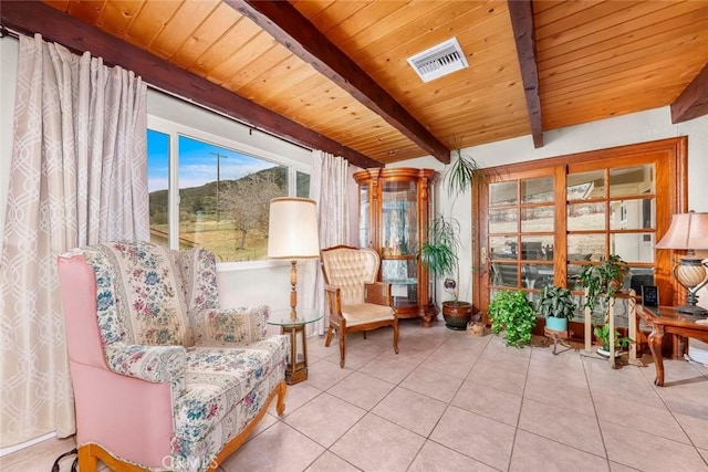 living area with wooden ceiling, lofted ceiling with beams, visible vents, and tile patterned floors