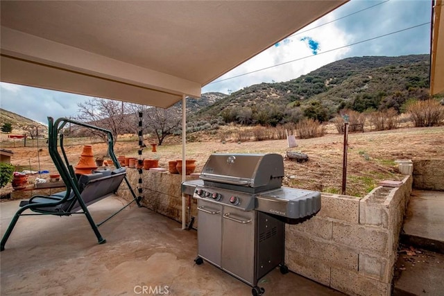 view of patio featuring area for grilling and a mountain view