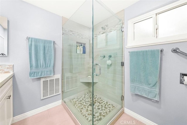 full bath with visible vents, baseboards, a stall shower, tile patterned floors, and vanity