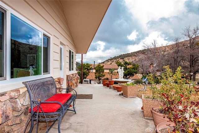 view of patio with a mountain view