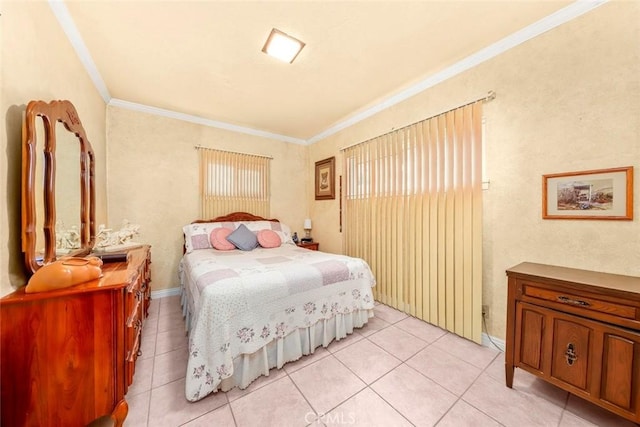 bedroom with access to exterior, light tile patterned flooring, and ornamental molding