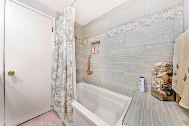 bathroom featuring shower / bathtub combination with curtain