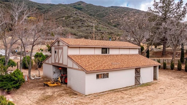 view of barn featuring a mountain view