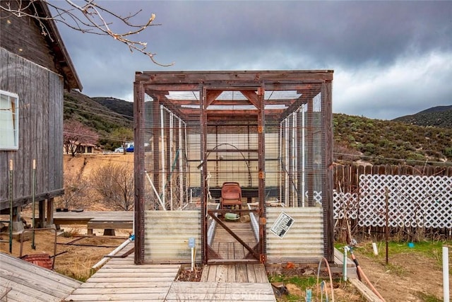 deck with a mountain view and an outdoor structure