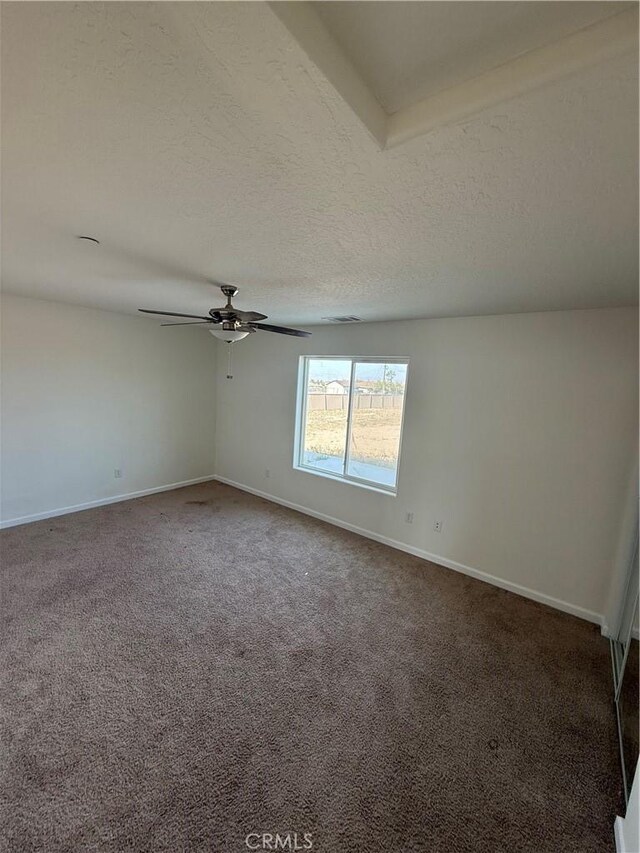 empty room with ceiling fan, baseboards, and carpet floors