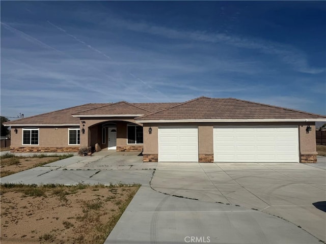single story home featuring stucco siding, driveway, stone siding, and a garage