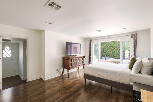 bedroom with access to exterior, visible vents, baseboards, and wood finished floors