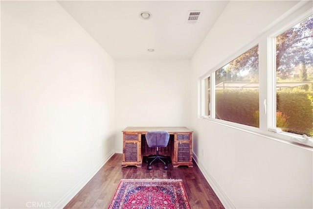 office space featuring recessed lighting, visible vents, baseboards, and wood finished floors