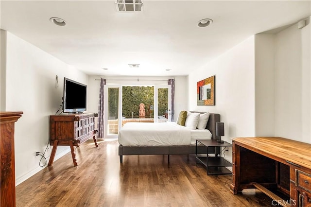 bedroom featuring recessed lighting, visible vents, dark wood-type flooring, and access to exterior