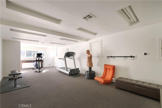 workout area with visible vents and carpet flooring