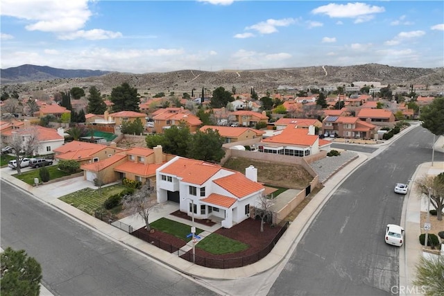 aerial view featuring a mountain view and a residential view