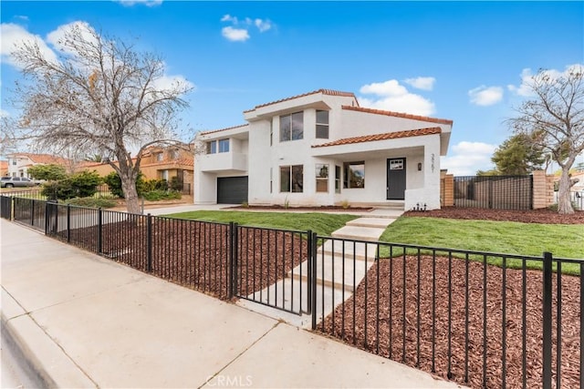 mediterranean / spanish-style home with a fenced front yard, a garage, driveway, and a tile roof