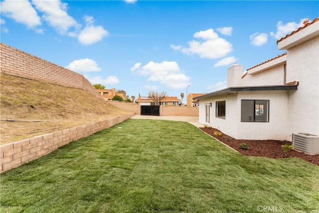 view of yard with cooling unit and a fenced backyard