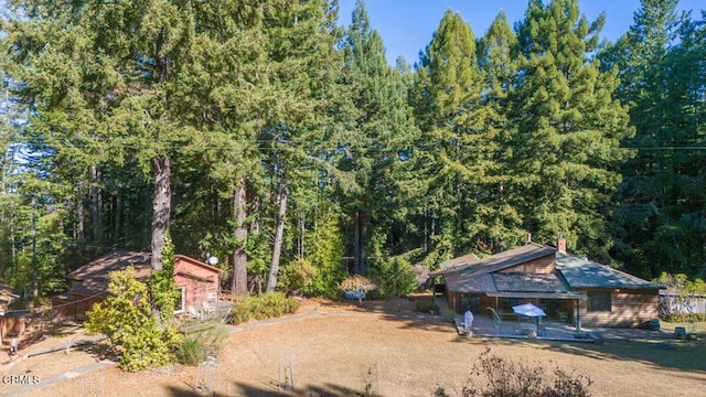 view of yard featuring a view of trees