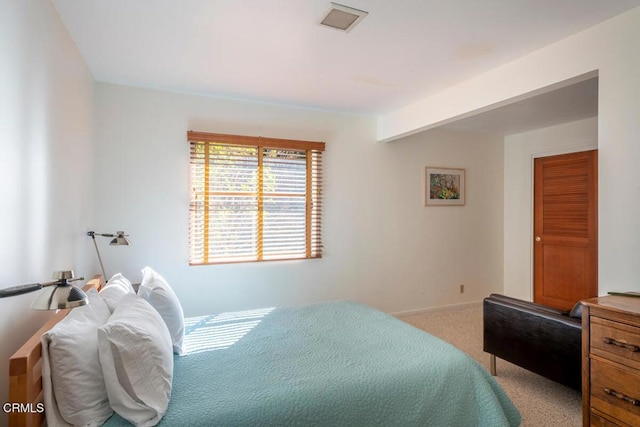 carpeted bedroom featuring baseboards