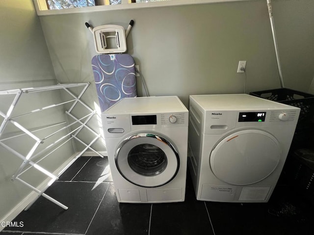 clothes washing area featuring laundry area and separate washer and dryer