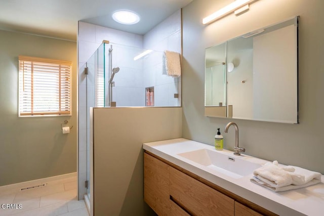 bathroom with vanity, a stall shower, and tile patterned flooring