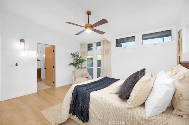 bedroom with multiple windows, baseboards, light wood finished floors, and ceiling fan