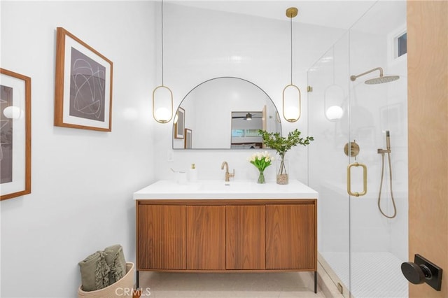 full bathroom with a stall shower and vanity