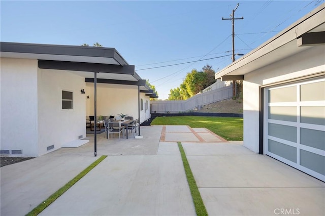 view of patio featuring visible vents and fence