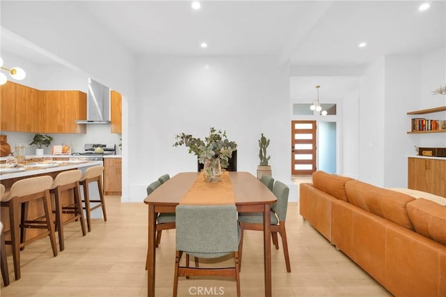 dining area with recessed lighting and light wood finished floors