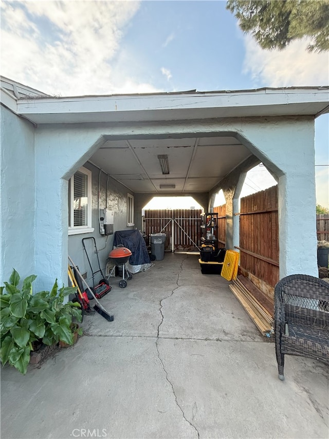 view of patio featuring fence