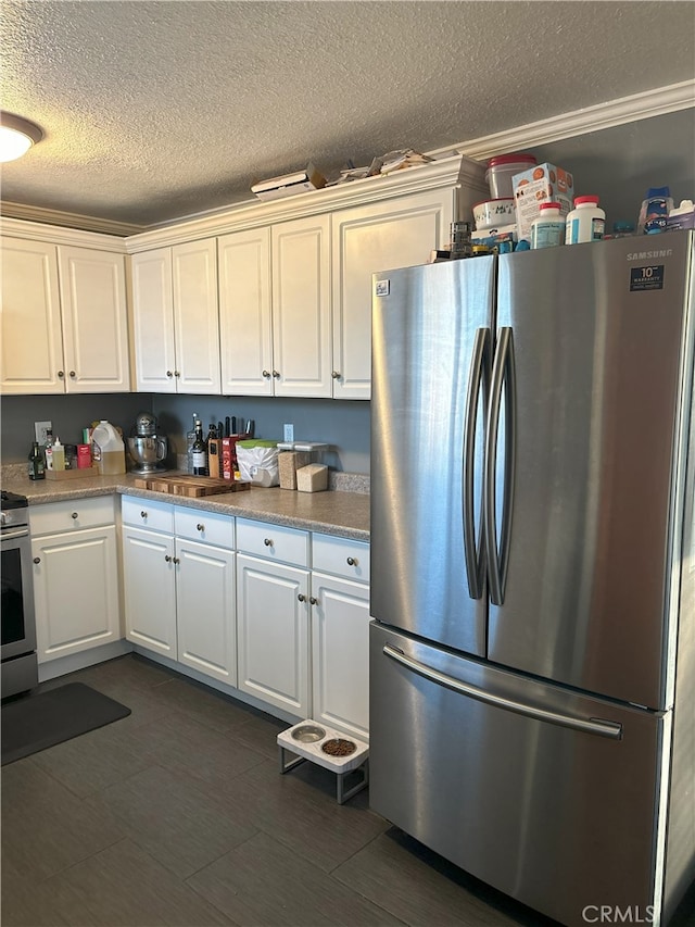 kitchen featuring white cabinetry, appliances with stainless steel finishes, and a textured ceiling