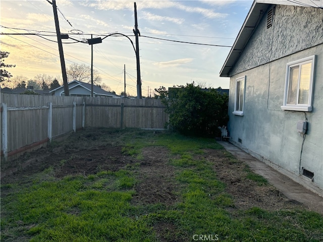 view of yard with a fenced backyard