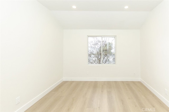 unfurnished room with recessed lighting, light wood-type flooring, and baseboards