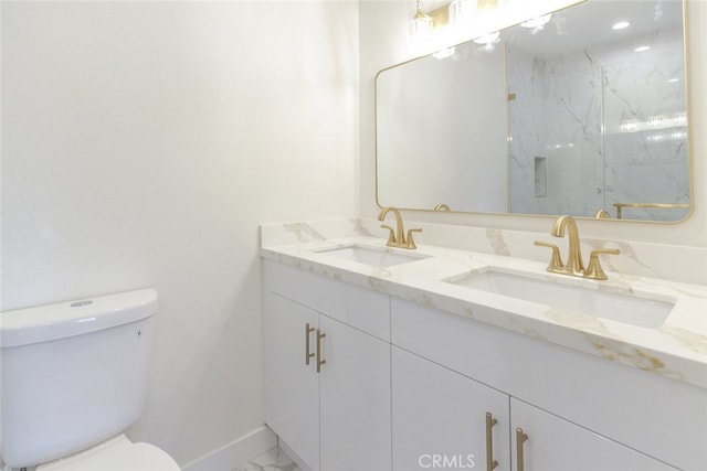 full bathroom with a sink, a marble finish shower, toilet, and marble finish floor