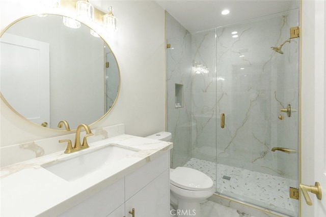 full bath featuring a marble finish shower, toilet, recessed lighting, marble finish floor, and vanity