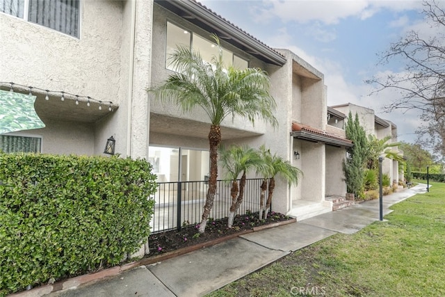 view of property with fence