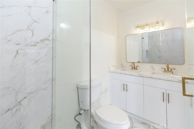 full bathroom featuring double vanity, toilet, marble finish floor, and a sink