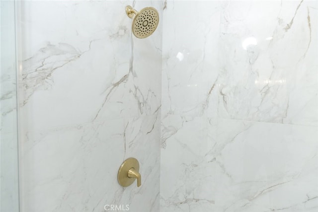 room details with a marble finish shower