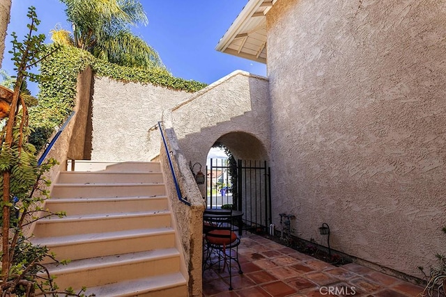 23461 Darcy Ln, Newhall, CA 91321 - doorway to property with stucco siding and a gate