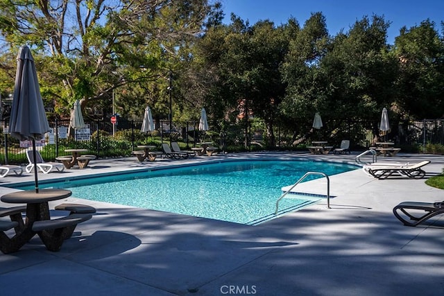 23461 Darcy Ln, Newhall, CA 91321 - community pool with a patio area and view of wooded area