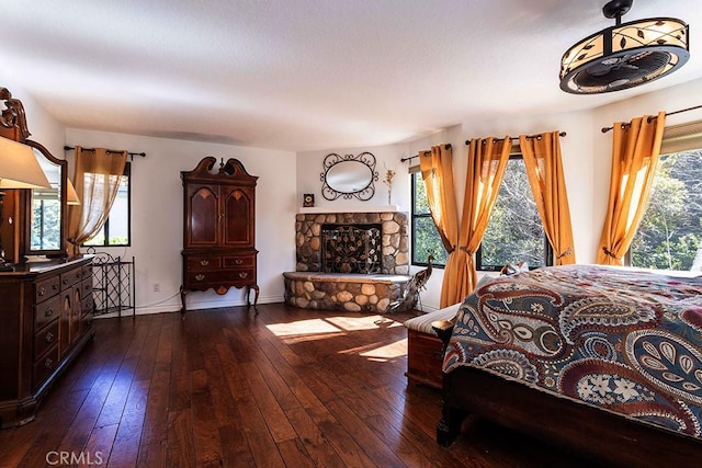 23461 Darcy Ln, Newhall, CA 91321 - bedroom featuring dark wood finished floors, a fireplace, and baseboards
