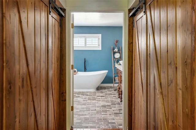 23461 Darcy Ln, Newhall, CA 91321 - bathroom with a freestanding bath and brick patterned floors
