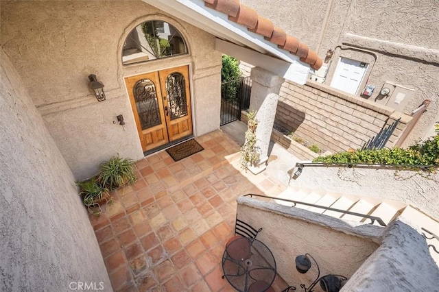 23461 Darcy Ln, Newhall, CA 91321 - entrance to property with french doors and stucco siding