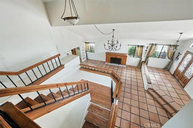 23461 Darcy Ln, Newhall, CA 91321 - stairs with a chandelier