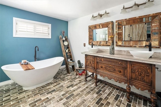 23461 Darcy Ln, Newhall, CA 91321 - full bath featuring double vanity, a freestanding bath, and brick patterned floors